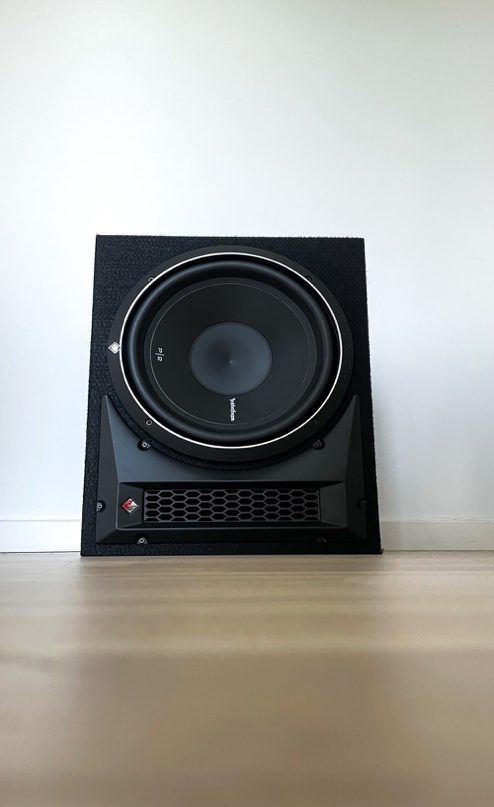 A Single Subwoofer on a Wooden Surface